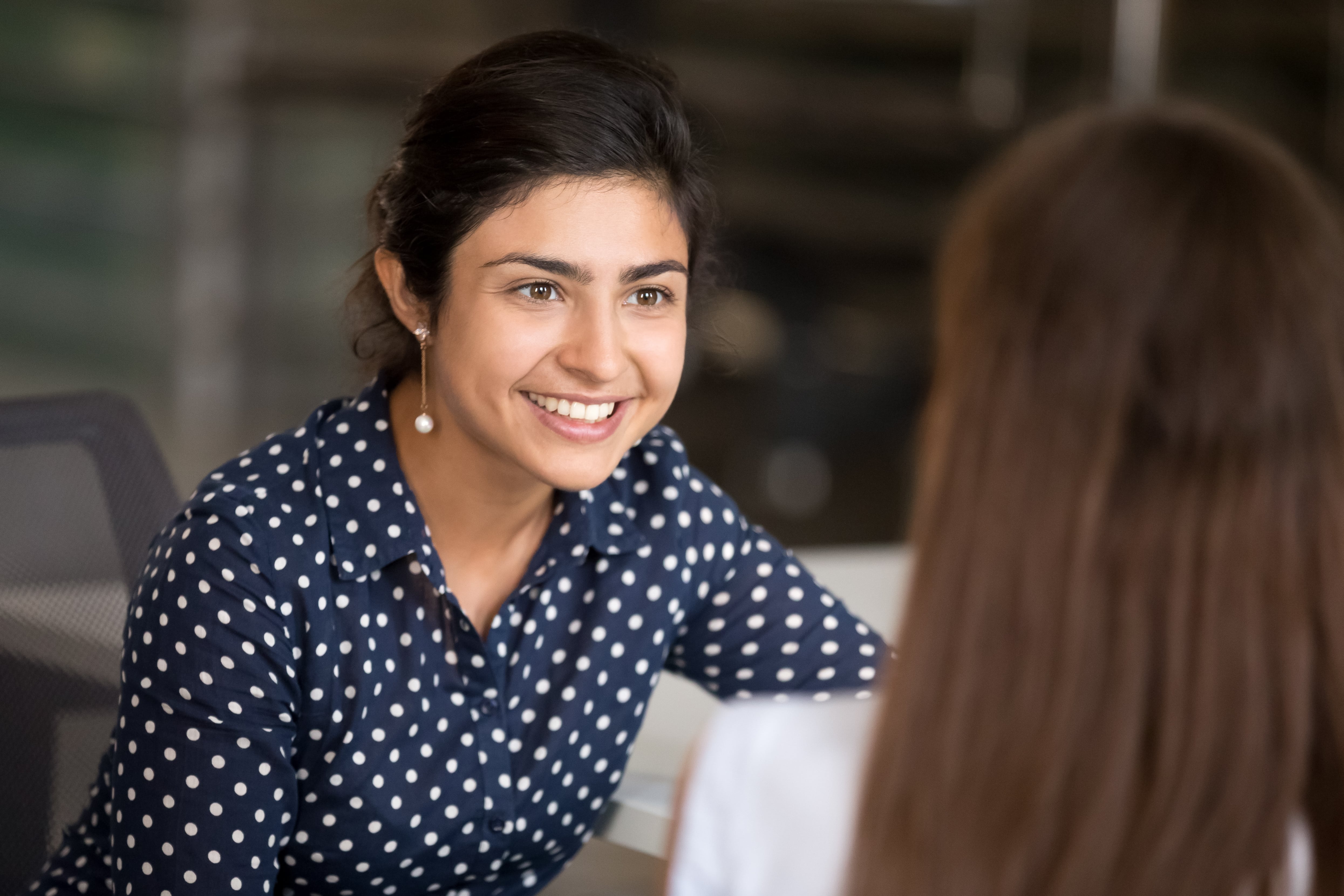 Young Indian woman talking